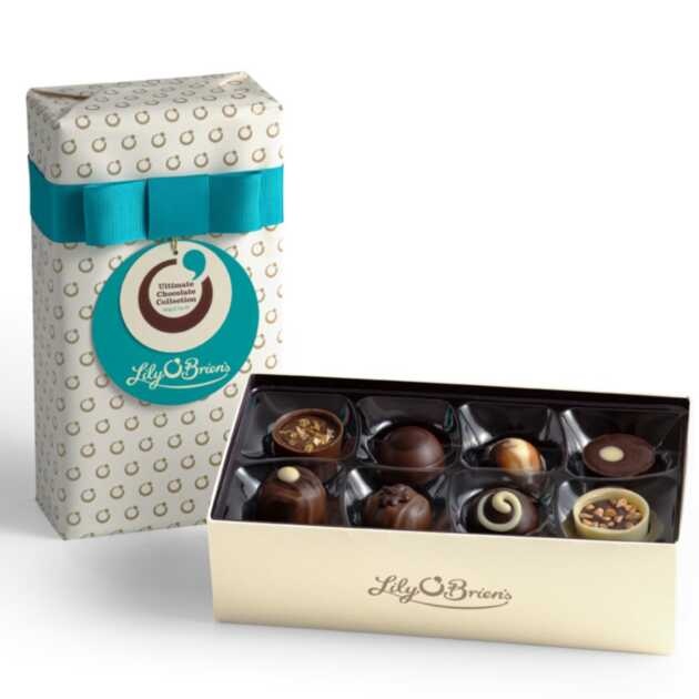 Lily O'Brien's Ultimate Chocolate Collection, gift wrapped in cream and gold paper complete with a turquoise bow.